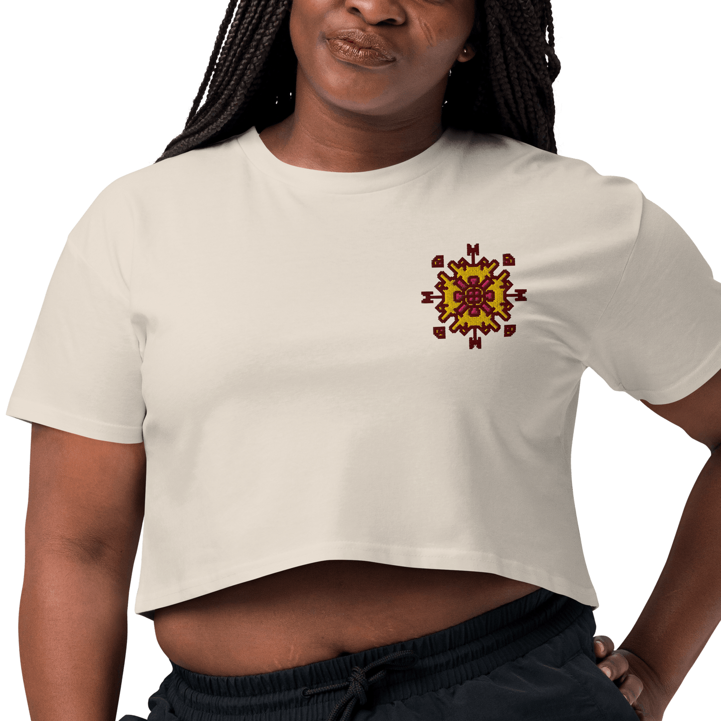 Person wearing a white t-shirt with a colorful design on a white background